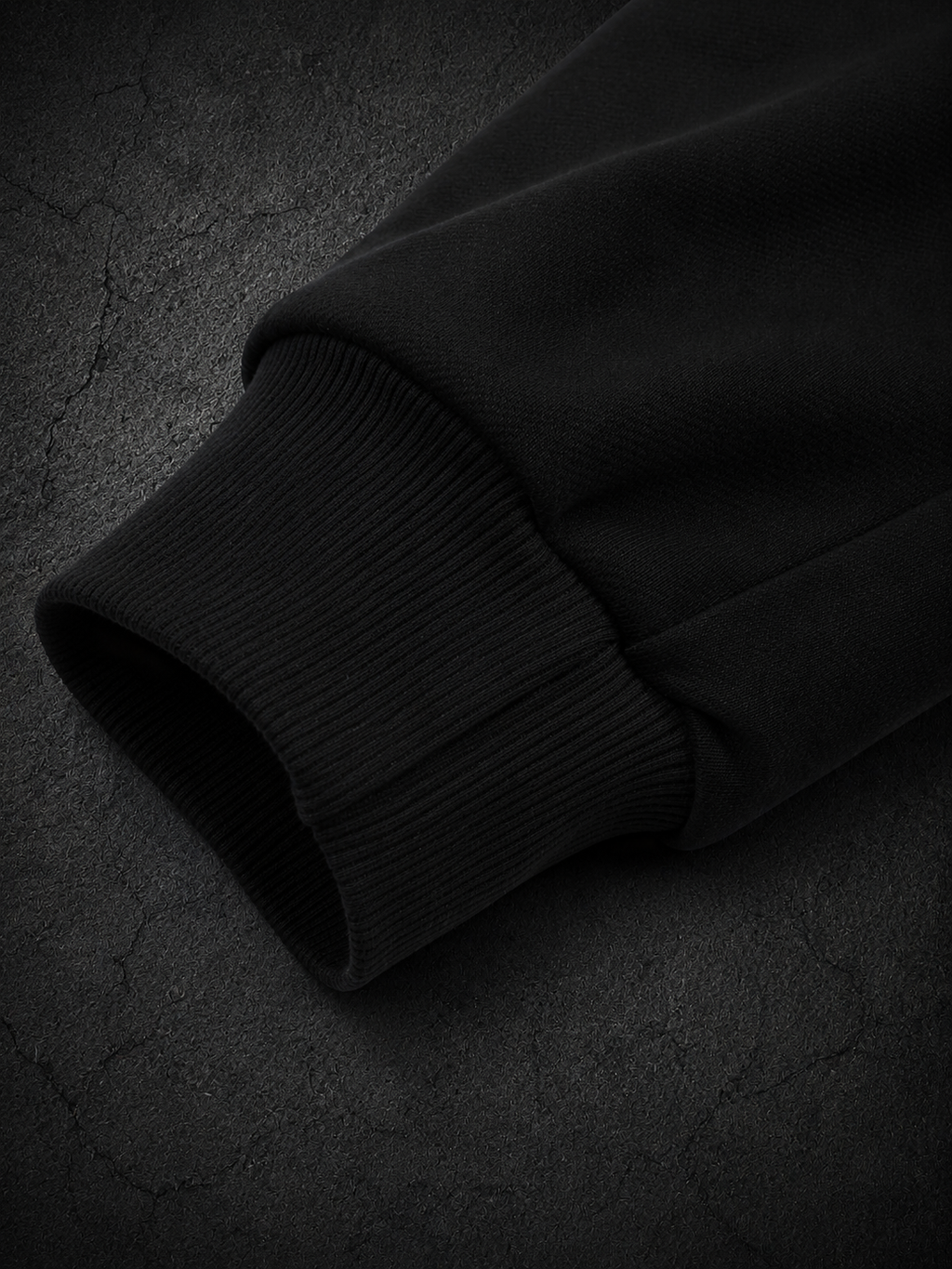 Black OLYMPUS Strength heavyweight hoodie sleeve close-up