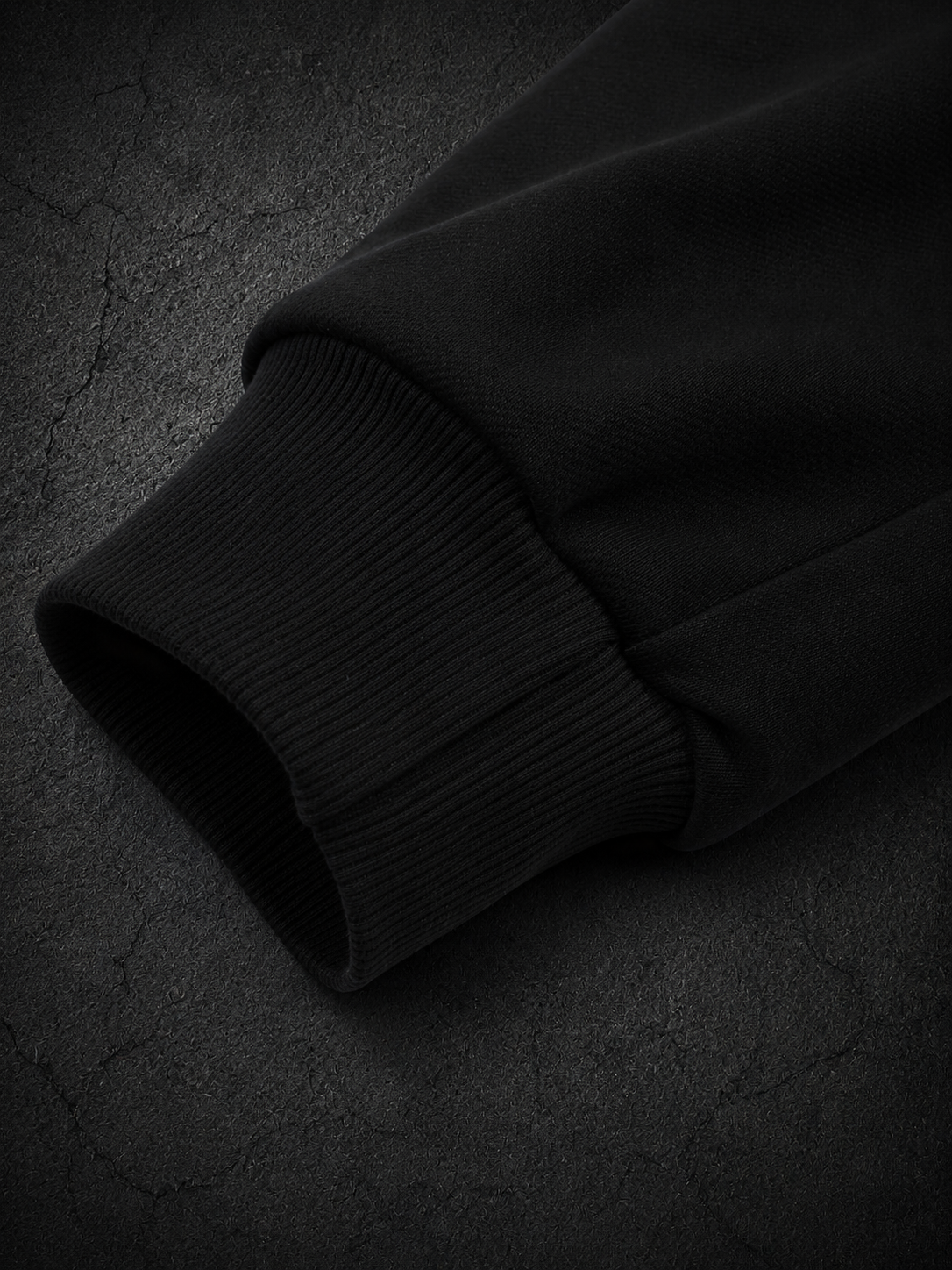 Black OLYMPUS Strength heavyweight hoodie sleeve close-up