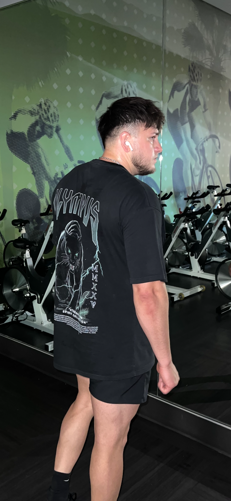 Pantera OLYMPUS heavyweight graphic tee back design worn by model in black